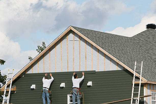 Professional Storm Damage Siding Repair technician working in Hutto, TX